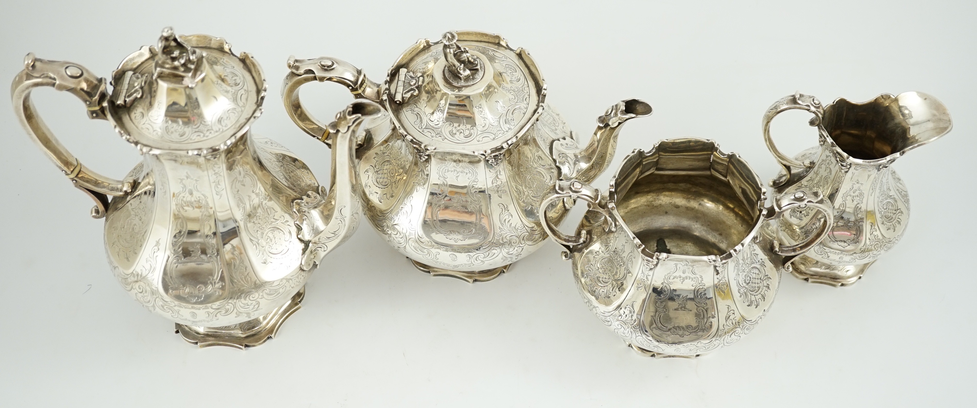 A Victorian silver pedestal four piece tea and coffee service by Robert Harper